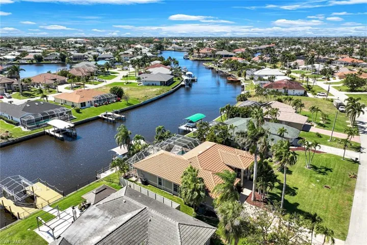 Aerial view featuring a residential view and a water view