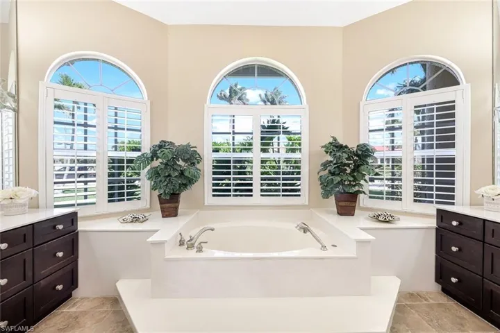 Bathroom featuring a bath and vanity