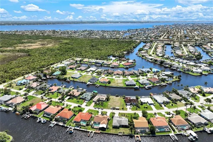 Birds eye view of property featuring a residential view and a water view