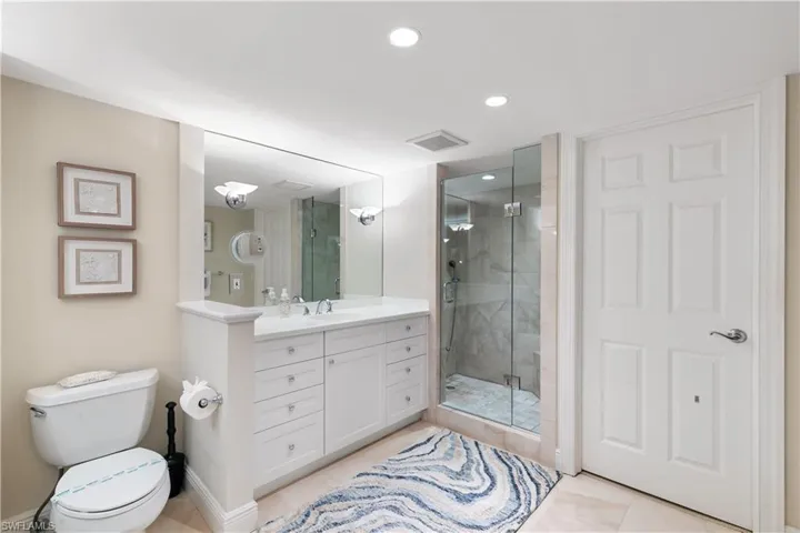 Not a typical Sandcastle primary bathroom, door is to the walk in closet