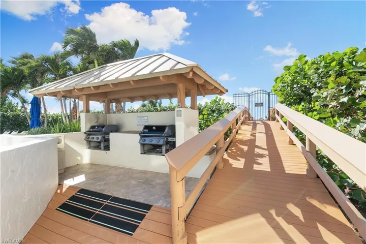 Covered BBQ area and boardwalk to the beach