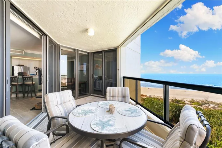 Accordion shutters by railing on lanai