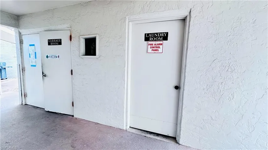 Property entrance featuring stucco siding