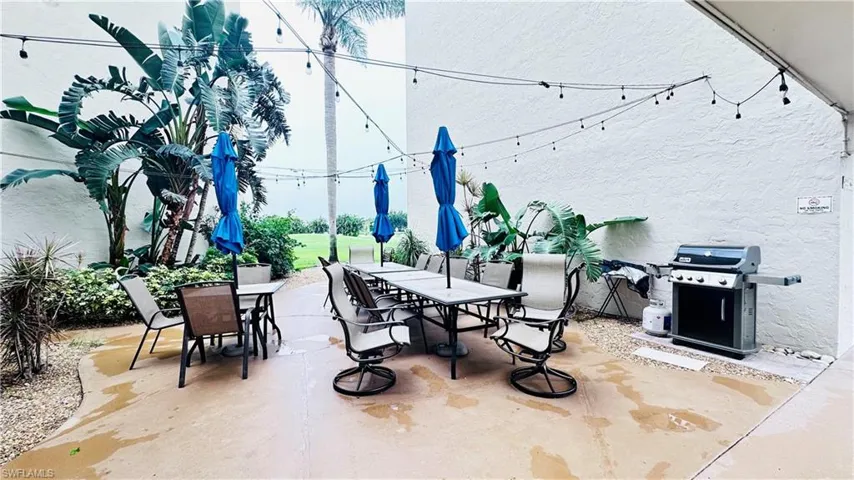 View of patio featuring outdoor dining space and area for grilling