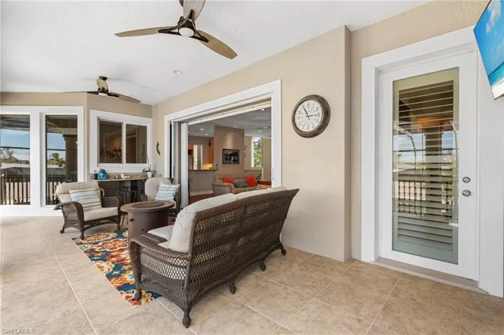 Balcony with spectacular views with an outdoor living space and ceiling fan