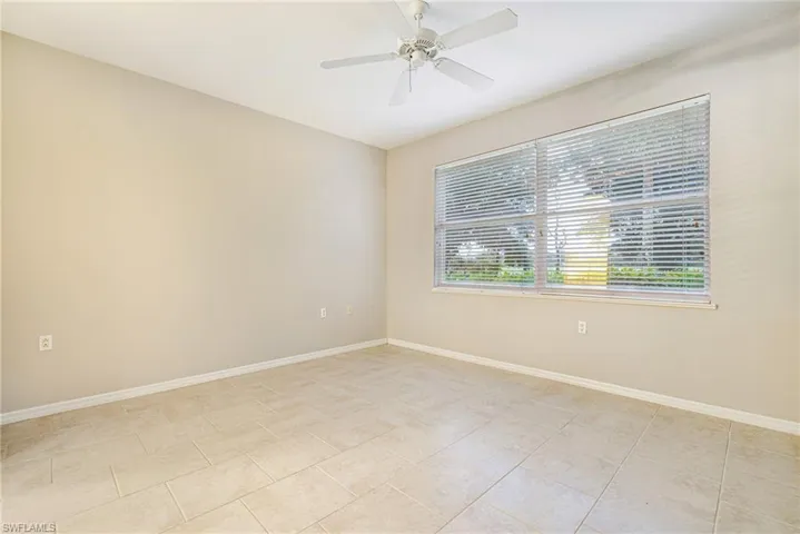 Master bedroom with tile flooring