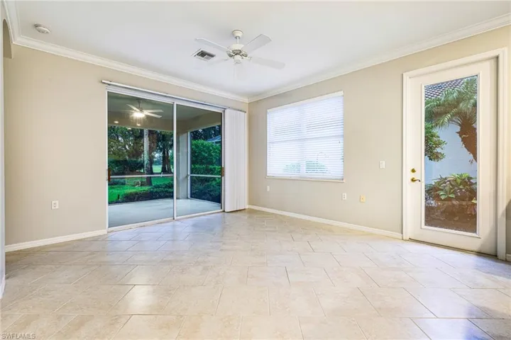 Great room with tile on the diagonal and crowns