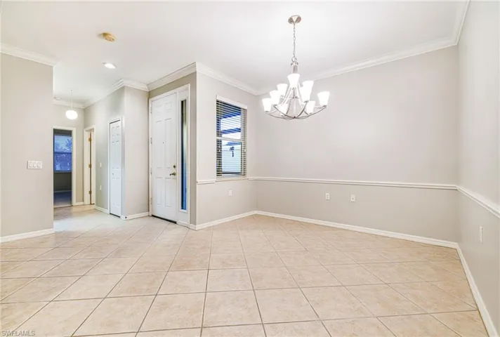 Dining area with chair rail and crown molding