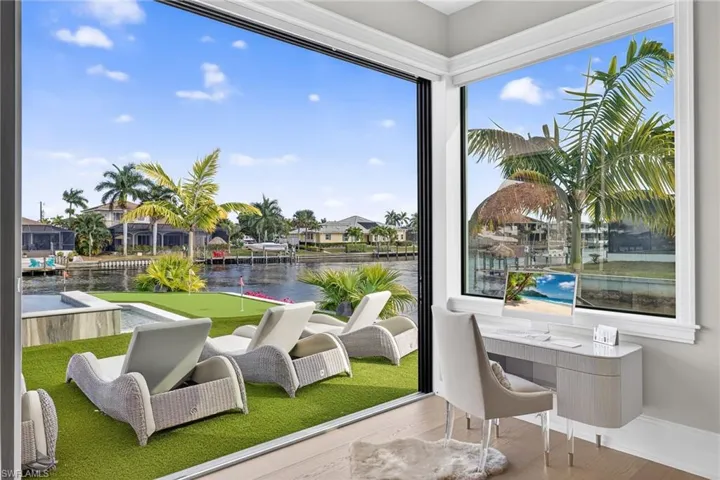 Sunroom / solarium with a water view