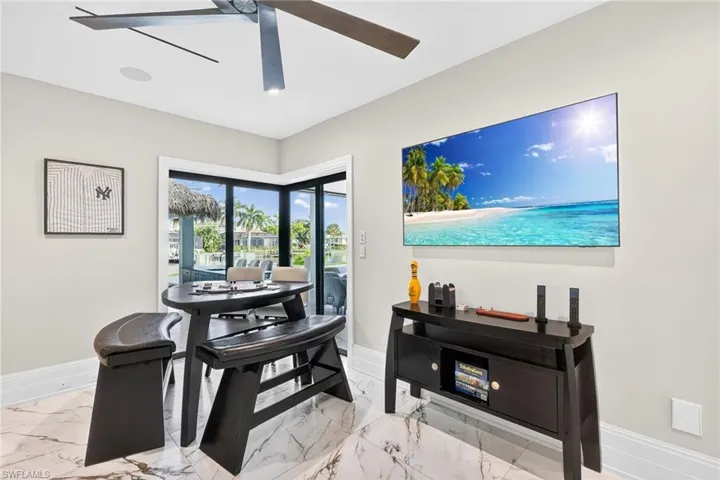 Office area with baseboards and ceiling fan