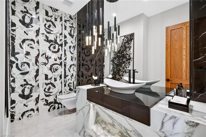 Powder bathroom with vanity and toilet