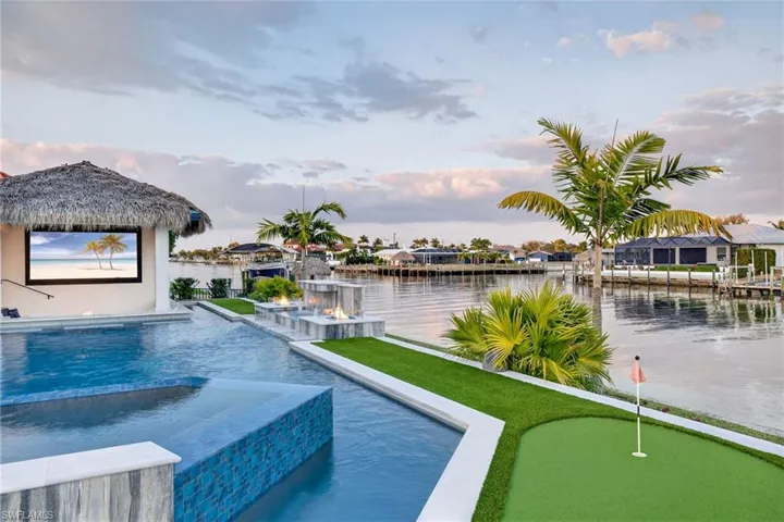 Integrated pool / hot tub with a putting area and a patio