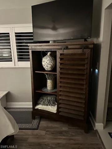 Detailed view of wood finished floors and baseboards
