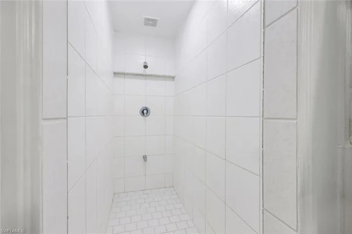 Full bathroom featuring tiled shower