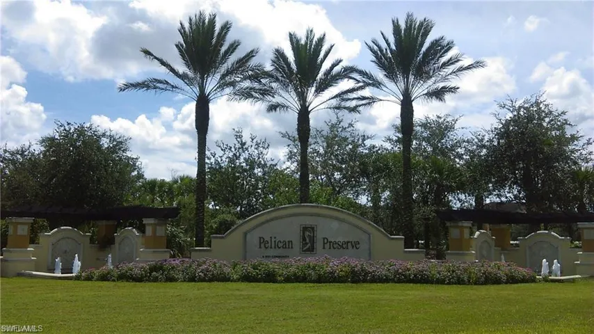 Community / neighborhood sign with a yard