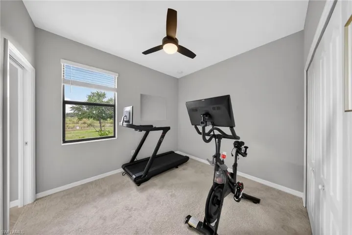 Downstairs bedroom currently used as a workout room