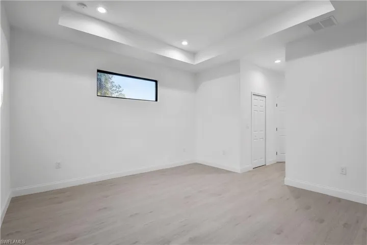 Unfurnished room featuring light wood-type flooring and recessed lighting