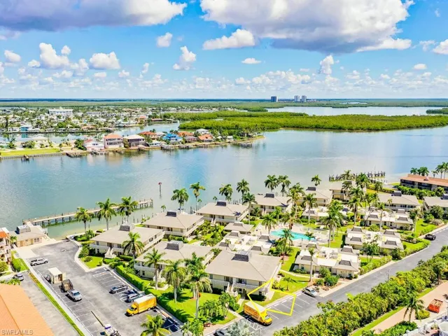 Birds eye view of property featuring a water view