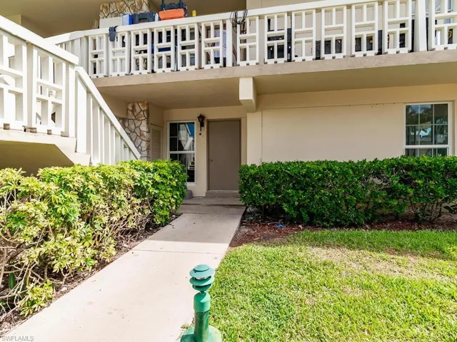 Doorway to property with a balcony
