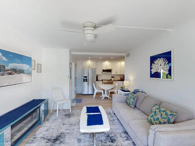 Living room featuring light hardwood / wood-style flooring and ceiling fan