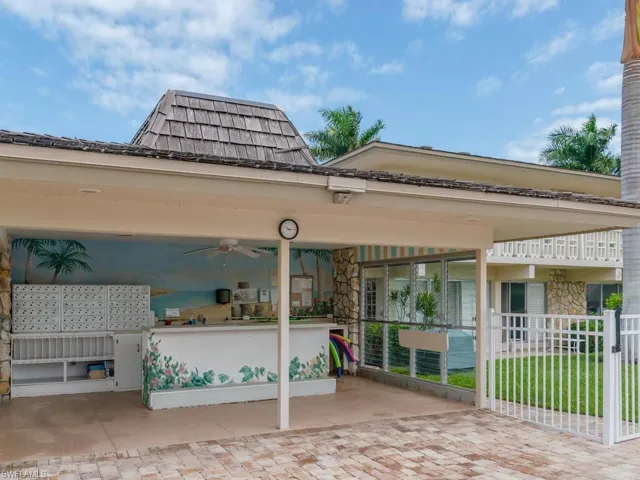 View of patio featuring ceiling fan and mail boxes