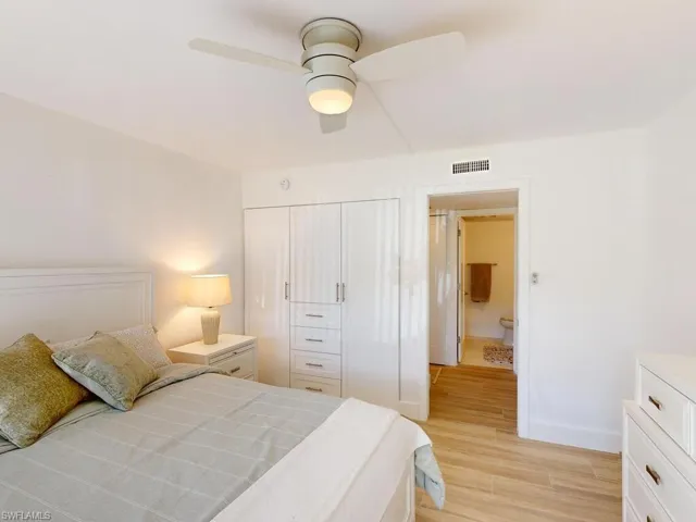 Bedroom featuring a closet, ceiling fan, and light hardwood / wood-style floors