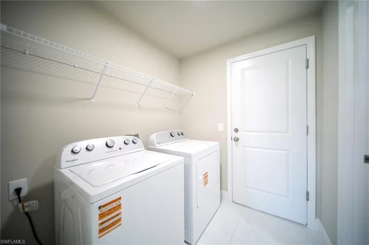 The Laundry Room Comes With A Brand New Washer & Dryer And Metal Shelving!