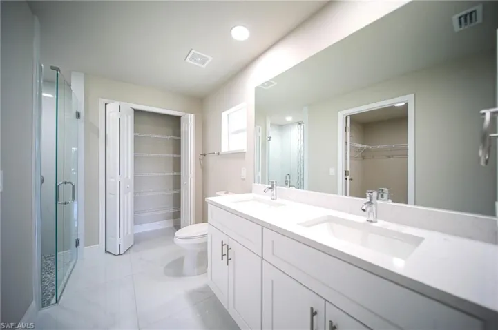 The Master Bathroom Comes With Quartz Countertops With Dual Sinks, Soft Touch Cabinets & Drawers, A Glass And Tile Custom Master Shower, And A Huge Linen Closet!