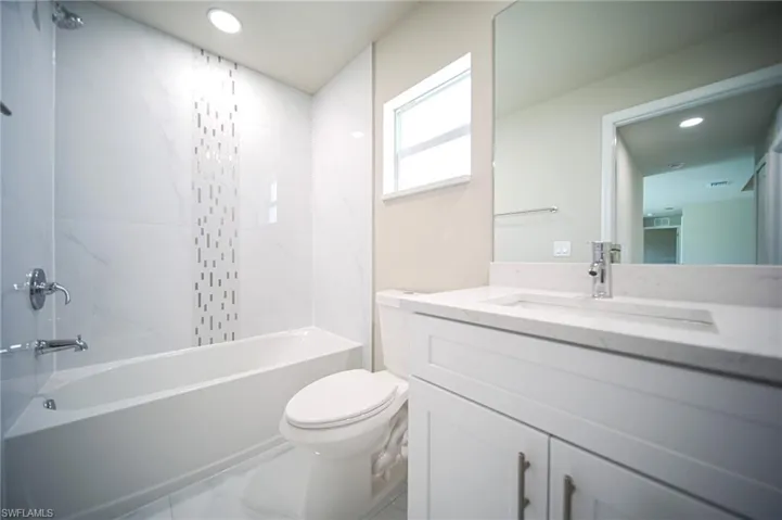 The Spare Bath Comes With Quartz Countertops, White Real Wood Soft Touch Cabinets & Drawers, And A Custom Tile Walls In The Tub Area!
