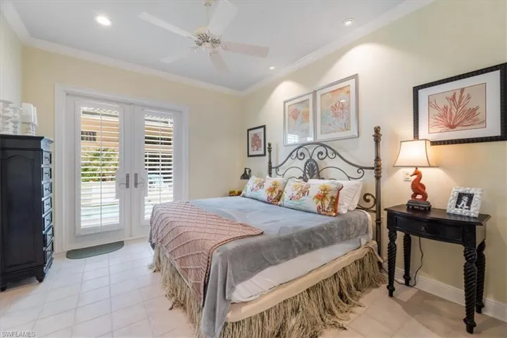 Bedroom with access to outside, ornamental molding, ceiling fan, french doors, and recessed lighting
