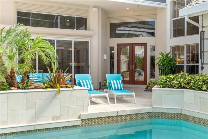 Outdoor pool featuring a patio area and french doors
