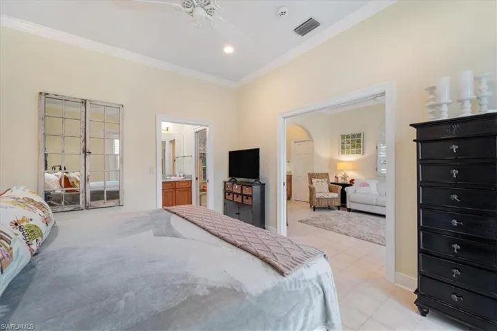 Bedroom with crown molding, a ceiling fan, recessed lighting, and connected bathroom