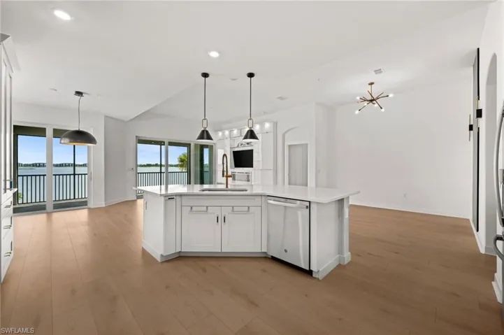 Kitchen looking out to living area and view of Lake Babcock