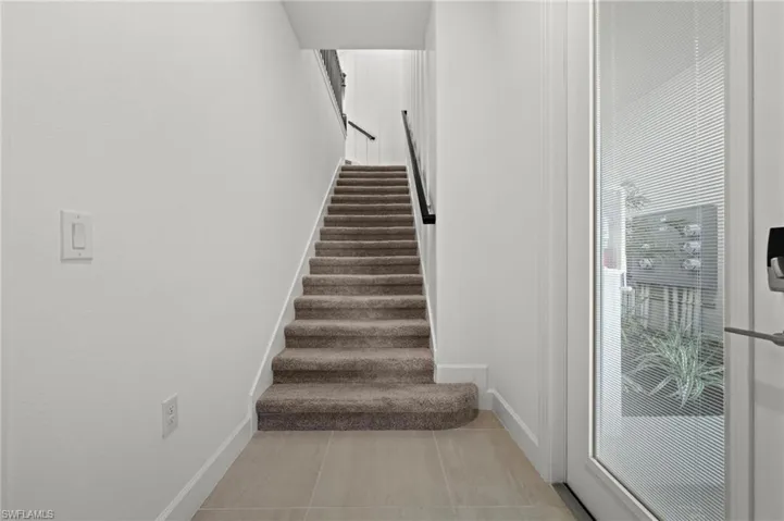 Stair from ground floor entry to living areas  Also accessible by private elevator.
