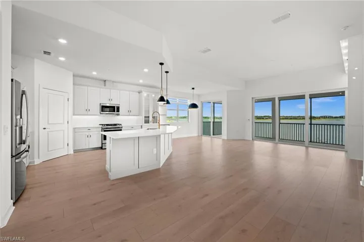 Open Concept Kitchen, Living, and Dining Areas with views of Lake Babcock