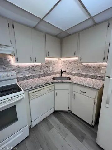 Granite counters with under mount lighting.