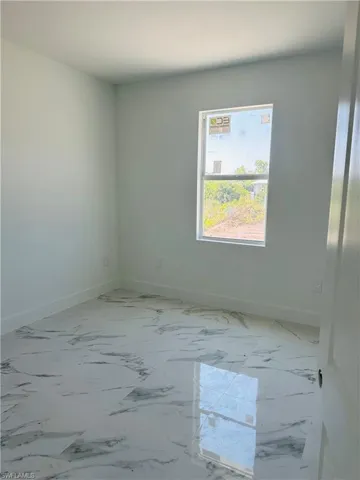 View of tiled spare room