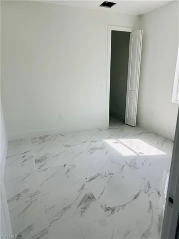 View of tiled spare room