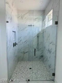 Bathroom featuring walk in shower