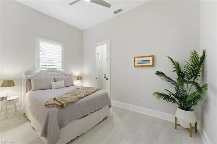Bedroom with light wood-type flooring and ceiling fan