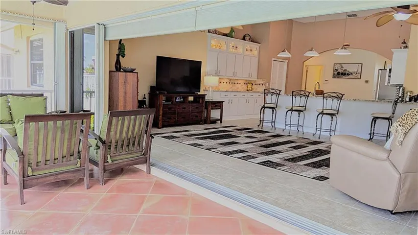 The Family Room Transitions Seamlessly onto the Entertainment size Lanai which is Surrounded by Ambient Night Lighting