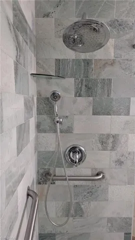 The Guest Bathroom Shower is a Soothing Waterfall Luxury Oasis.