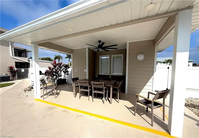 View of patio / terrace with outdoor dining area and a ceiling fan