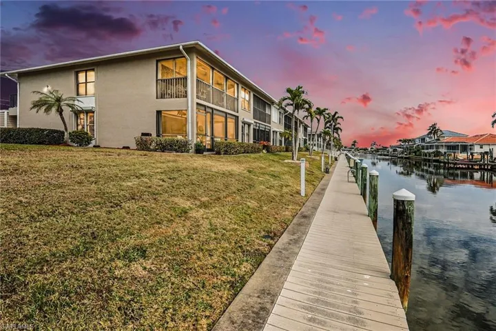 Dock featuring a yard and a water view