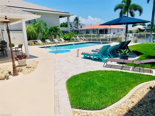 Community pool with a patio area