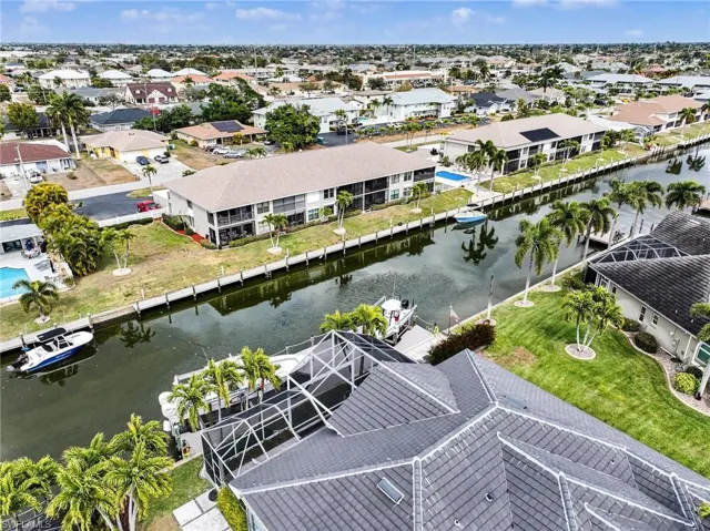 Aerial view of residential area featuring a large body of water