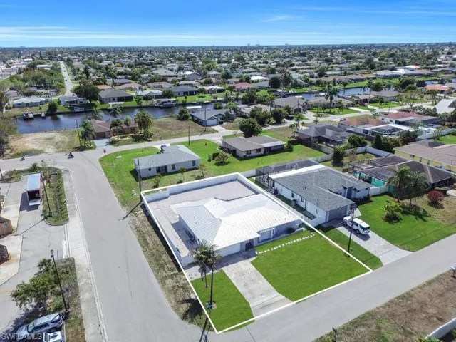 Aerial view of residential area with a nearby body of water
