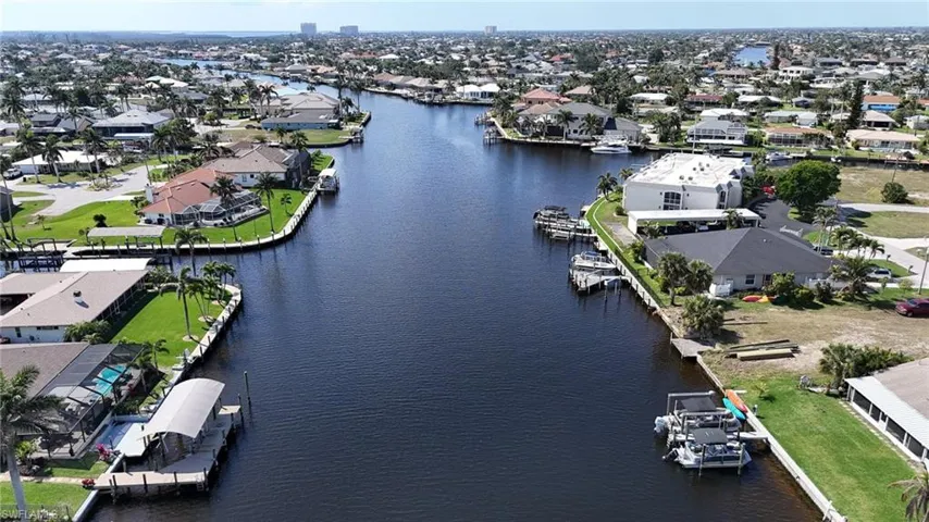 Drone / aerial view featuring a water view and a residential view