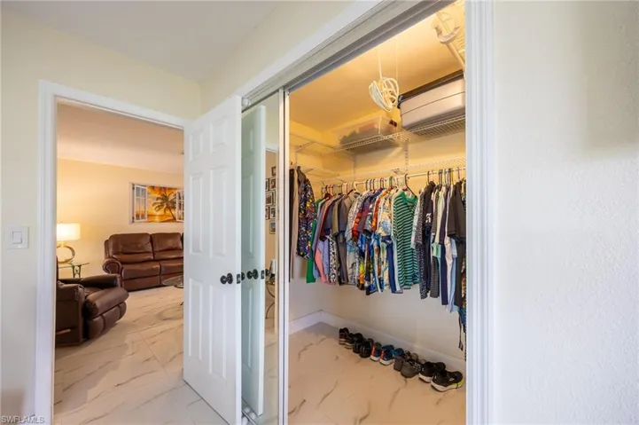 Spacious closet with marble finish floor