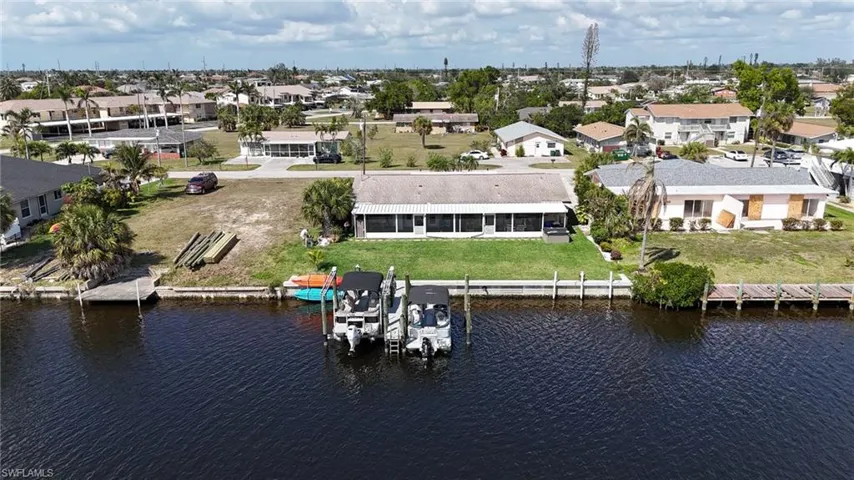 Bird's eye view with a water view and a residential view